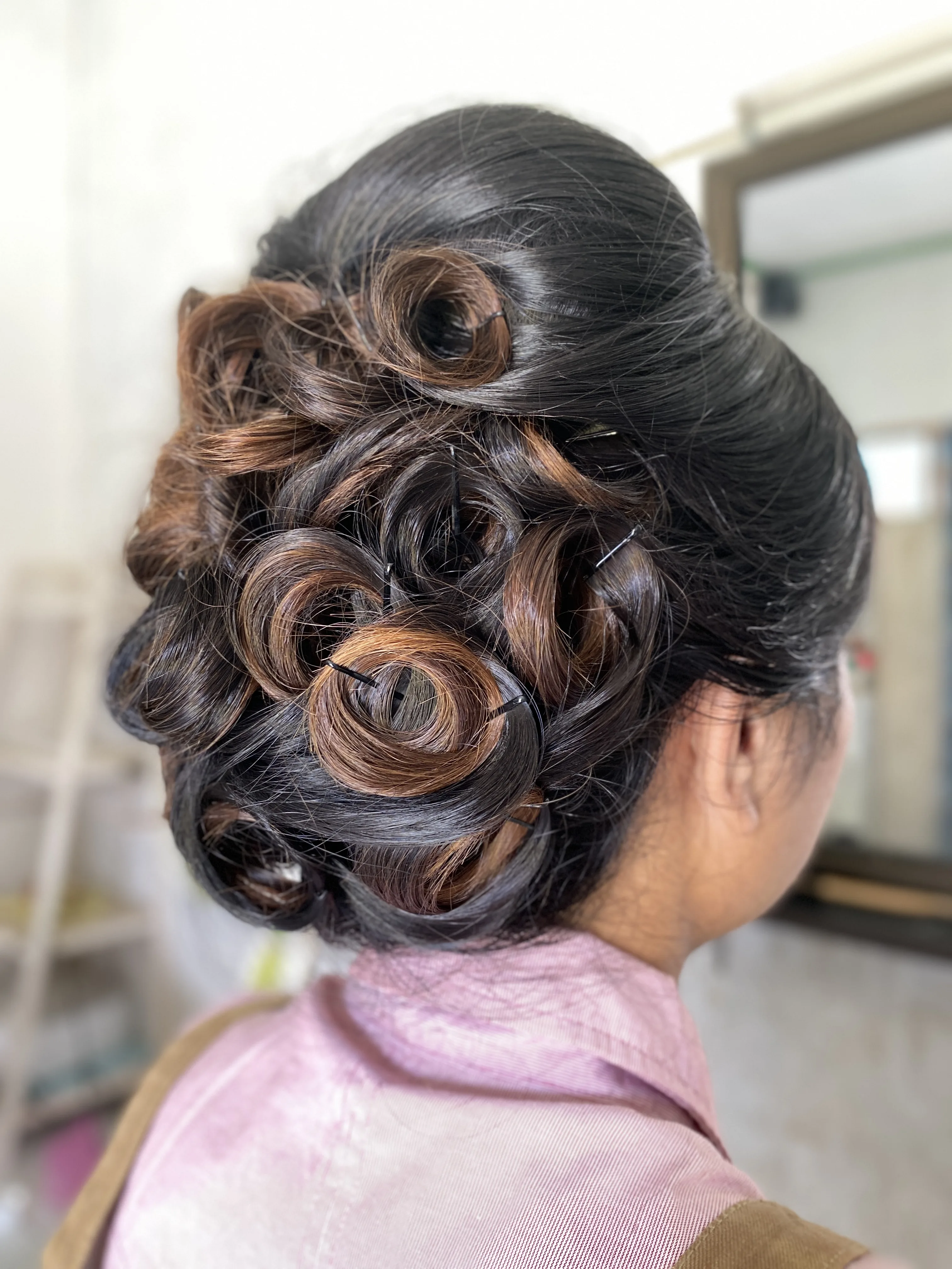 Sanggul Kreasi — sleek bridal finish